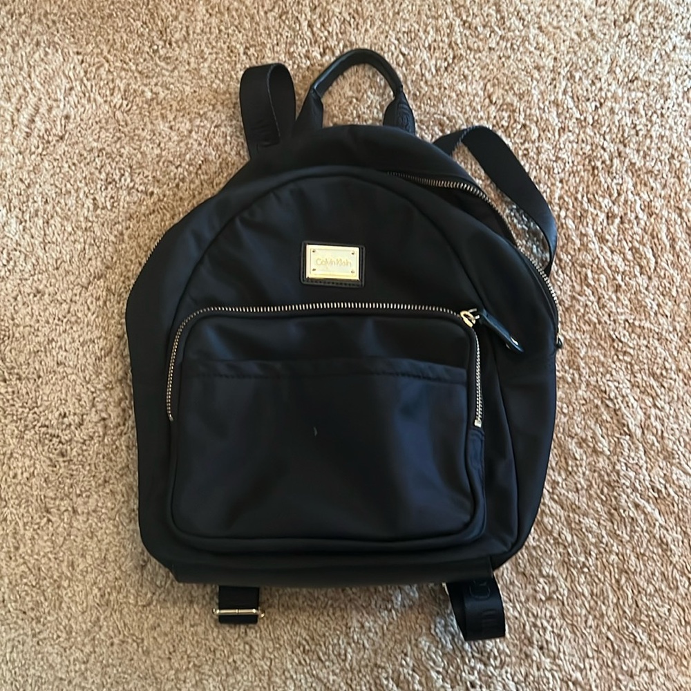 Calvin Klein Black Backpack with Gold Plaque